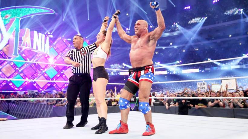 Ronda Rousey and Kurt Angle celebrate