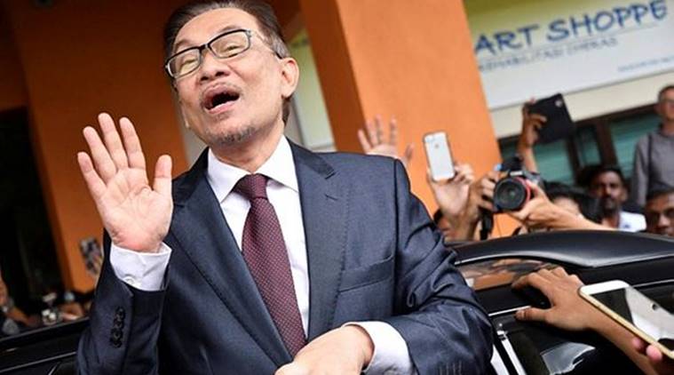 Jailed Malaysian leader Anwar Ibrahim walks free after royal pardon