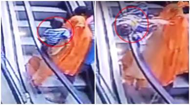 baby slips from mothers hands, baby falls escalator, baby slips escalator gap, baby falls mothers hands, baby fall, baby falls escalator death, baby india escalator fall, indian express, indian express news
