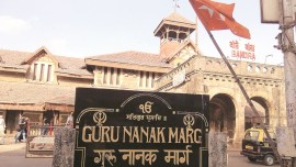 A signage of Guru Nanak Marg outside the Bandra station;