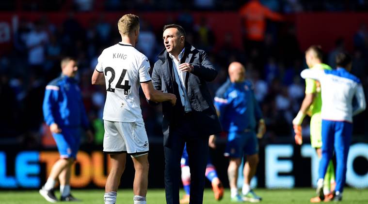 Swansea City manager Carlos Carvalhal with Andy King after the match as they are relegated from the Premier League