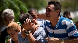 Grieving relatives of passengers who perished in Cuba's worst aviation disaster arrive at the morgue in Havana on Saturday. (AP)