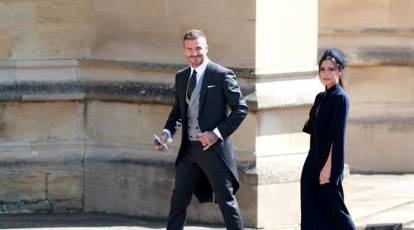 David Beckham walks hand-in-hand with Victoria as they head out