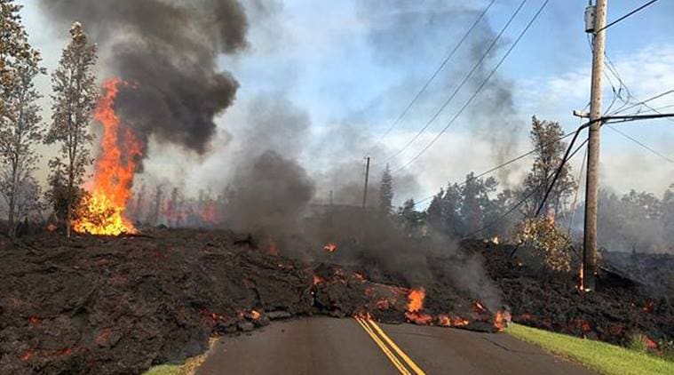 Lava advances along a street near a fissure in Leilani Estates, on Kilauea Volcano's lower East Rift Zone. (Reuters)