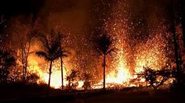 A new fissure spraying lava fountains as high as about 230 feet (70 m), according to United States Geological Survey, is shown from Luana Street in Leilani Estates subdivision on Kilauea Volcano's lower East Rift Zone in Hawaii. (Reuters)