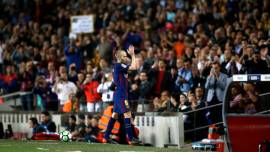 FC Barcelona's Andres Iniesta applauds after being substituted during the Spanish La Liga soccer match between FC Barcelona and Villarreal at the Camp Nou stadium in Barcelona