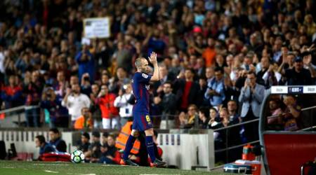FC Barcelona's Andres Iniesta applauds after being substituted during the Spanish La Liga soccer match between FC Barcelona and Villarreal at the Camp Nou stadium in Barcelona