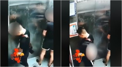 men peeing in elevator, peeing buddies video viral men peeing in elevator viral, men peeing in elevator with woman watching video viral, men in
