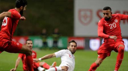 Portugal's Joao Moutinho in action with Tunisia’s Ghailan Chaalali