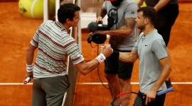 Grigor Dimitrov and Milos Raonic at the net in Madrid Open