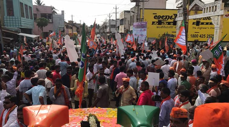 Close to a thousand workers and supporters of the party carried BJP flags and shouted slogans of ‘Bharat Mata ki jai’ and ‘BSY, BSY’ as the roadshow, touted to be a show of strength by the party, moved through Shikaripura. (Express photo/Aaron Pereira)
