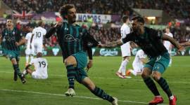 Southampton's Manolo Gabbiadini celebrates scoring their first goal with Charlie Austin against Swansea City