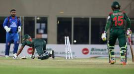 Bangladesh Shakib Al Hasan jumps to save a run out during the third T20 cricket match between Afghanistan and Bangladesh in Dehradun