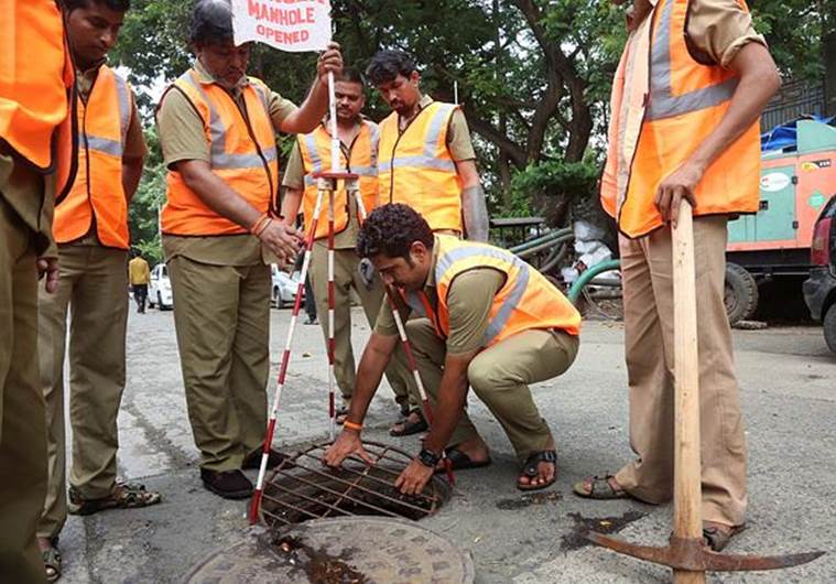Chaughule, 32, is part of a mammoth effort undertaken by the BMC each monsoon to minimise flooding at spots prone to waterlogging. (Express photo/Amit Chakravarty)