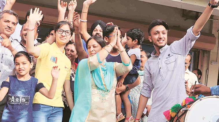 Eliza Bansal (wearing glasses) celebrates with family members on Monday. Express