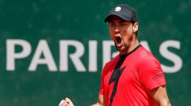 Italy's Fabio Fognini clenches his fist after scoring a point against Britain's Kyle Edmund during their third round match of the French Open tennis tournament at the Roland Garros