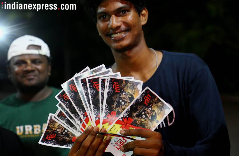 fans pose with tickets of kaala