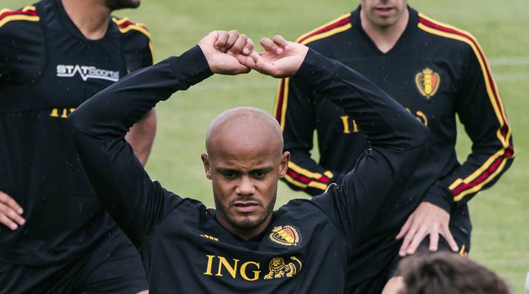 Belgium's Vincent Kompany warms up with other Belgian players during a training session at the Belgian Football Center in Tubize, Belgium