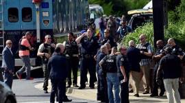 Police walk near the shooting scene after the gunman opened fire at the Capital Gazette newspaper in Annapolis, Maryland, on Thursday. (Reuters)