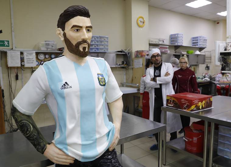 Bakers of Altufyevo Confectionery prepare a life-size chocolate sculpture of Argentine soccer player Lionel Messi to top a cake for the celebration of his upcoming birthday in Moscow