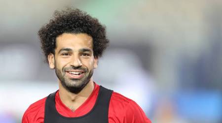 Soccer Football - FIFA World Cup - Egypt Training - Cairo Stadium, Egypt - June 9, 2018 - Egypt's Mohamed Salah smiles next to his teammates in Cairo international stadium in Cairo.   REUTERS/Mohamed Abd El Ghany