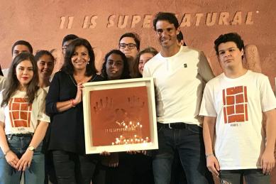 Paris Mayor Anne Hidalgo, left, presents Rafael Nadal, right, with framed handprints bearing 11 fingers in a nod to the 11th French Open titles he won, during a ceremony held at the Paris city hall