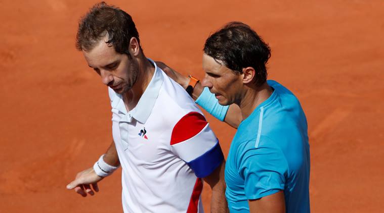 Rafael Nadal with France's Richard Gasquet after winning their third round match at French Open
