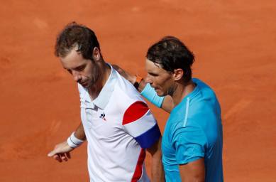 Rafael Nadal with France's Richard Gasquet after winning their third round match at French Open
