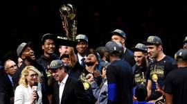 Golden State Warriors guard Stephen Curry (30) celebrates with the Larry O'Brien Championship Trophy after beating the Cleveland Cavaliers in game four of the 2018 NBA Finals at Quicken Loans Arena.