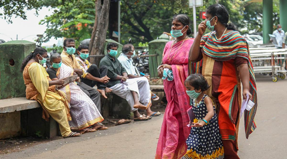 People wear safety masks as a precautionary measure after the 'Nipah' virus outbreak at Kozhikode Medical College in Kerala.