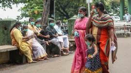 People wear safety masks as a precautionary measure after the 'Nipah' virus outbreak at Kozhikode Medical College in Kerala.