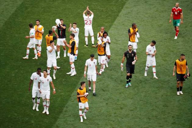 Portugal players applaud their fans after the match against Morocco