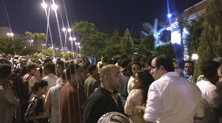 Fans gather outside Egypt's beloved striker Mohamed Salah's home in Madinaty compound, just outside Cairo, Egypt, after his arrival with Egypt's national team from Russia following a disappointing World Cup showing.