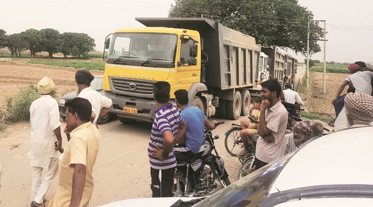 The sand mining truck intercepted by the villagers in Mohali on Saturday. (Express photo)