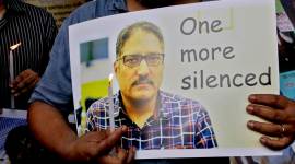 A journalist participates in a silent protest against the brutal killing of senior Kashmiri journalist Shujaat Bukhari. (AP)