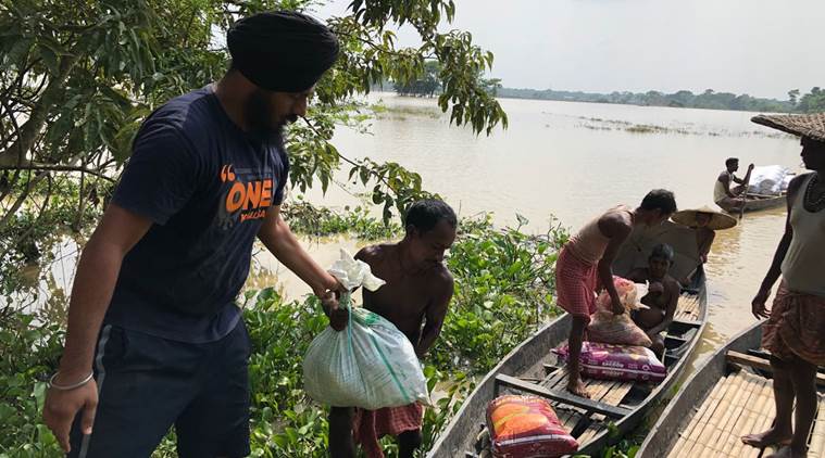 The relief teams are hiring boats from locals to reach the concerned areas and fields that have been completely washed away in flood waters. (Express photo)