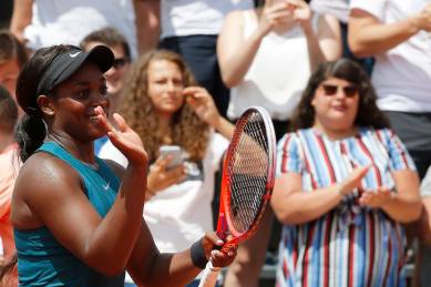 Sloane Stephens applauds after defeating Camila Giorgi during their third round match of the French Open.