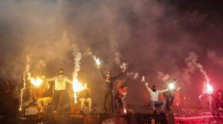  Spartak Moscow’s fans burn flares during a match against Arsenal in 2017. (Source: AP)