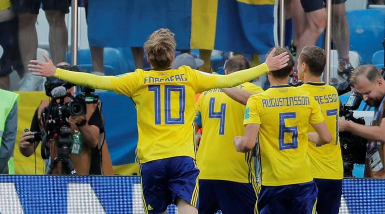 Sweden's Andreas Granqvist celebrates with team mates in front of their fans after scoring their first goal