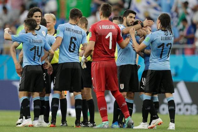 Uruguay's players celebrate after beating Saudi Arabia 1-0 in a group A match at the 2018 soccer World Cup in Rostov Arena in Rostov-on-Don, Russia