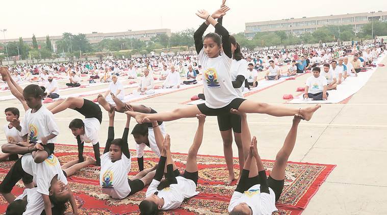 Students of Ashiana Children’s Home in Sector 16, Panchkula, perform yoga on Parade Ground on Thursday. (Express photo/Jaipal Singh)