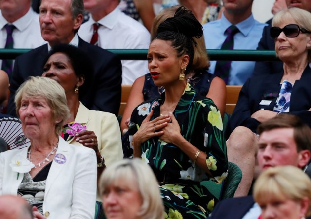 Actress Thandie Newton watches Spain's Rafael Nadal continue his semi final match against Serbia's Novak Djokovic, which was suspended yesterday, after running late.