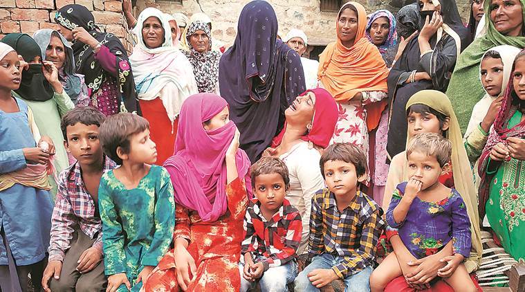 Akbarâ€™s wife with their children. (Express photo/Hamza Khan)