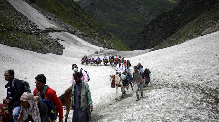 Red flags go up over rains, but Amarnath pilgrims push forward on dangerous 3-km trek