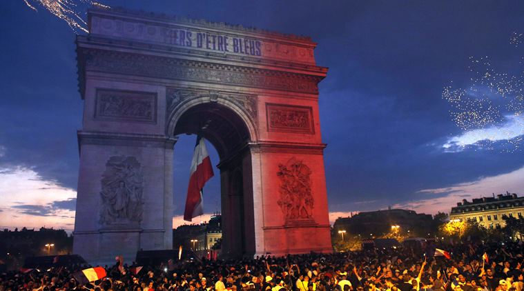 With flags, song, pride, French celebrate unifying victory