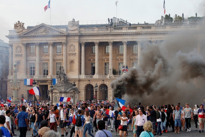 France fans celebrate on the Place de la Concorde after France win the Soccer World Cup final.