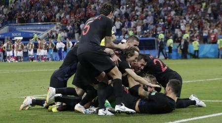 Sochi : Croatia's Luka Modric, top, celebrates with Dejan Lovren after winning the quarterfinal match between Russia and Croatia at the 2018 soccer World Cup in the Fisht Stadium, in Sochi, Russia, Saturday, July 7, 2018. AP/PTI(AP7_8_2018_000024A)