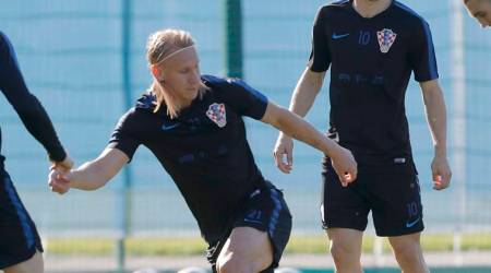 Croatia's Domagoj Vida, left, Luka Modric, centre, and Mateo Kovacic attend Croatia's official training in Roschino near St. Petersburg, Russia, Thursday, June 28, 2018, at the 2018 soccer World Cup. (AP Photo/Dmitri Lovetsky)