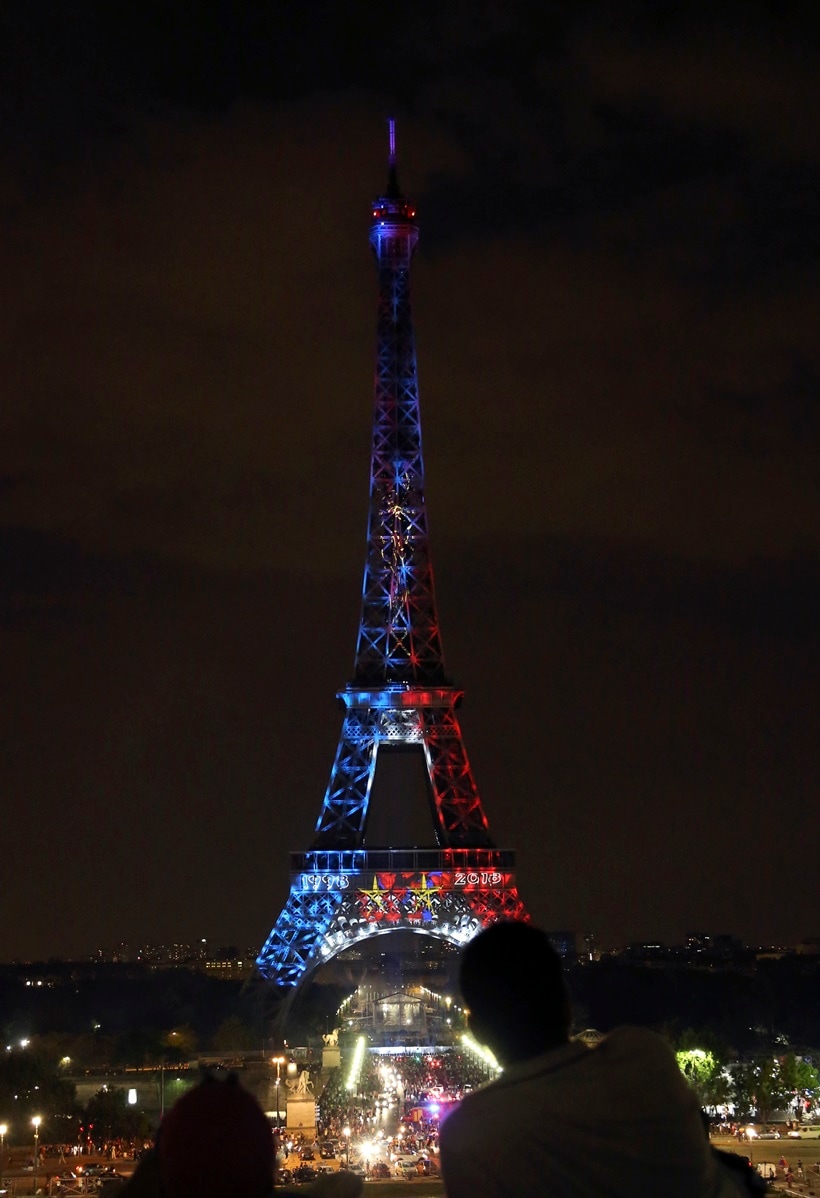 The Eiffel Tower is illuminated with the colors of France after France won the World Cup final between France and Croatia