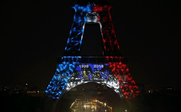 The Eiffel Tower is illuminated with the colors of France and the years of the soccer World Cup wins after France won the World Cup final between France and Croatia